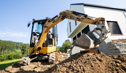Hero image showing a skid steer loader at a construction site.